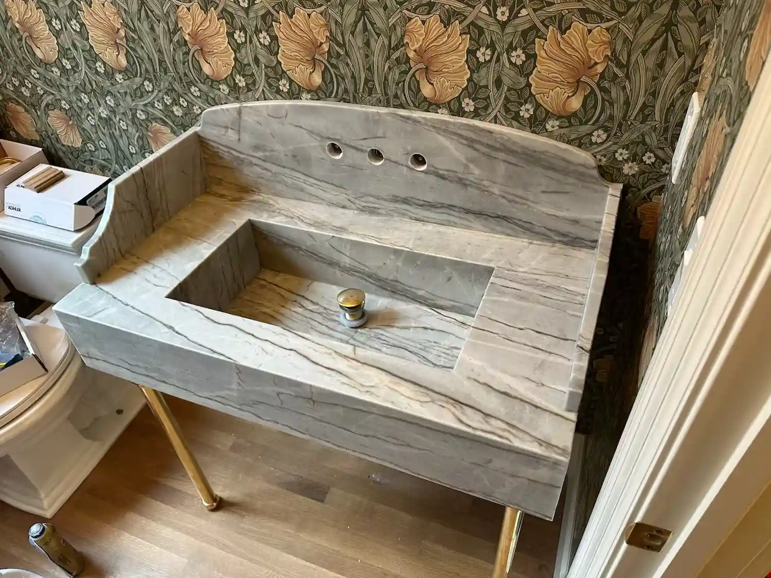 Custom carved marble vessel sink vanity