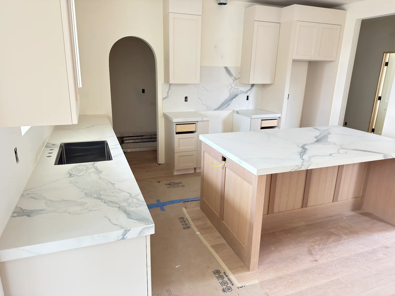 White marble kitchen countertops and backsplash